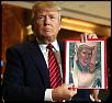Trump holding pic of sucking dick #1.jpg‎